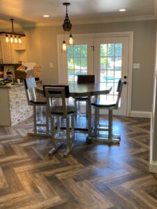 The dining space looks elegant with the table and chairs